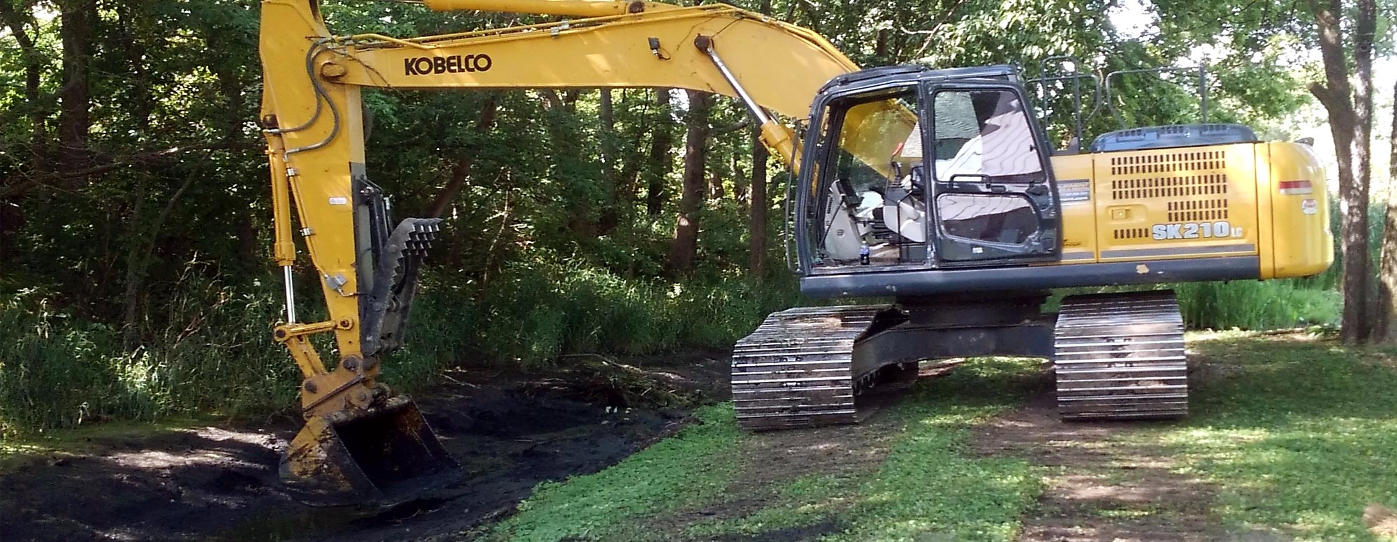 Large excavator digging for a septic system