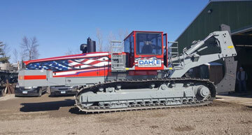 Dahle Enterprises' American-Flag themed field tiling machine | Field Drainage